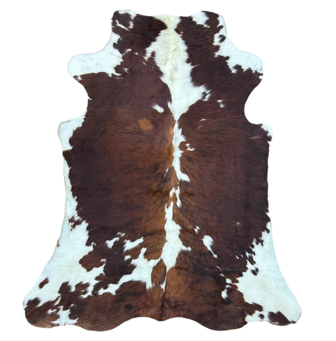 Brown and white cowhide rug 