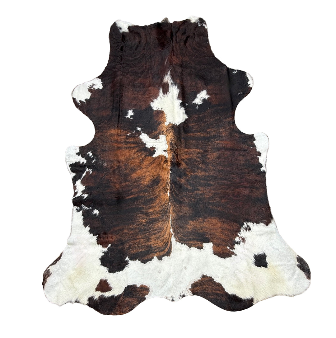 Cowhide rug with brown, white, and black pattern 