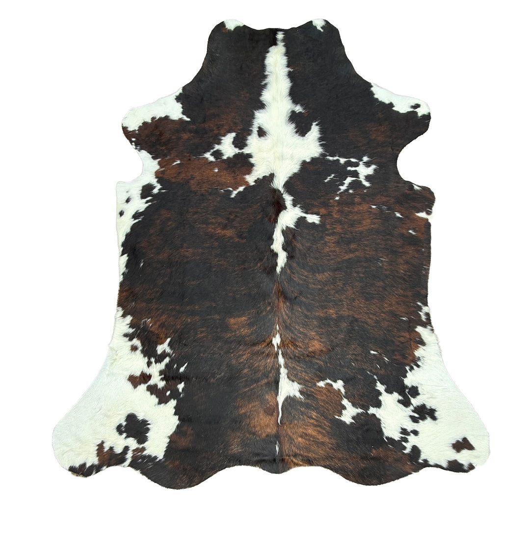Brown and white cowhide rug 