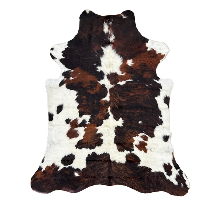 Cowhide rug with brown, white, and black pattern 