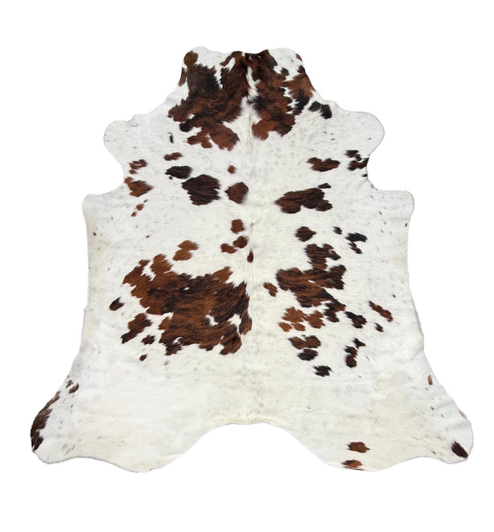 Cowhide rug with brown and black spots 