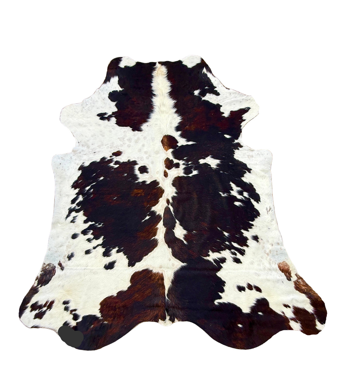 Cowhide rug with black and brown spots