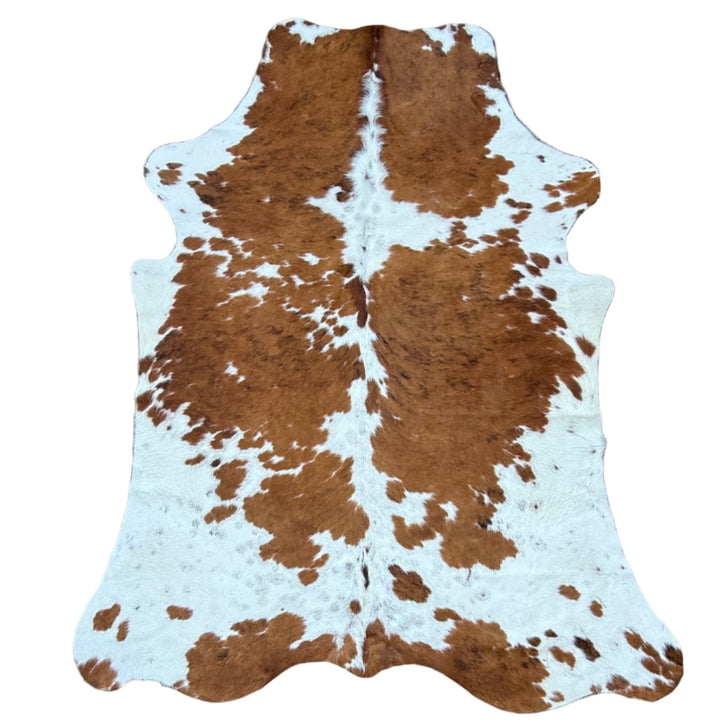 Brown and white cowhide rug 