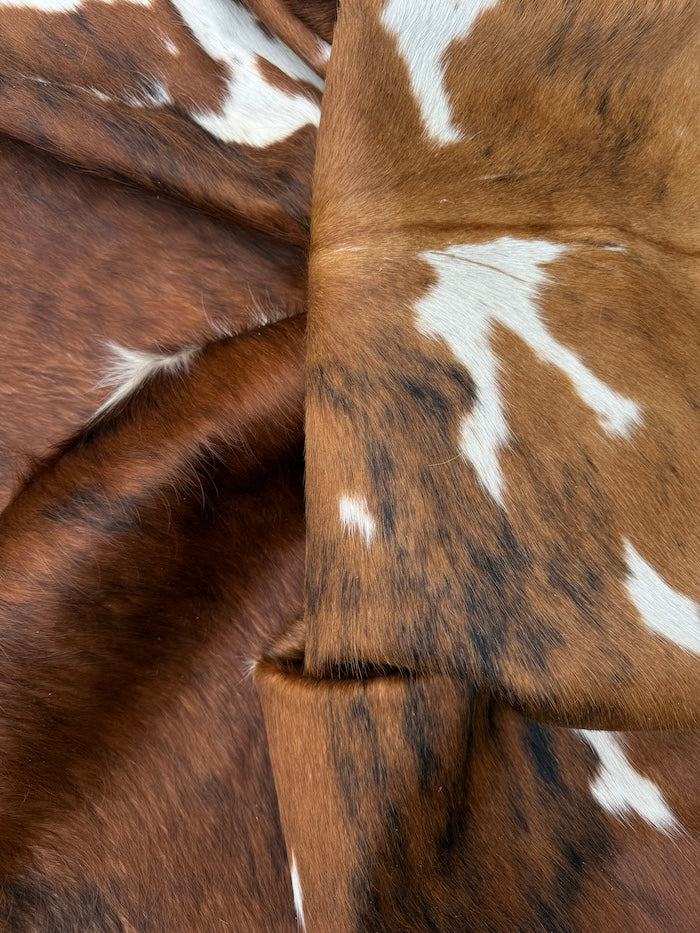 Extra large Brazilian Tricolour Cowhide Rug by Cowhide Rugs London, 225x210cm, featuring bold black, white, and brown patches.