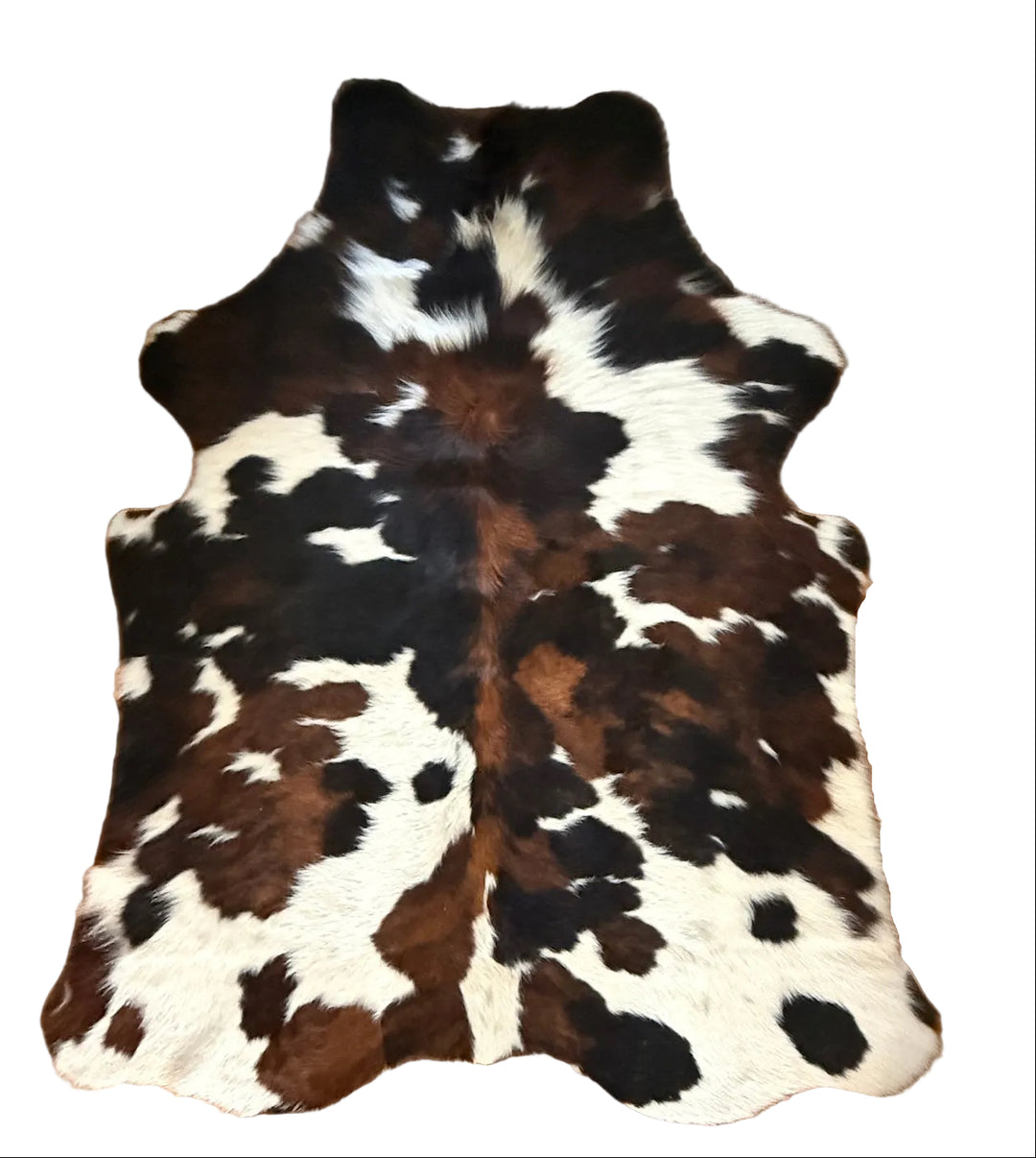 Cowhide rug with brown, black, and white 