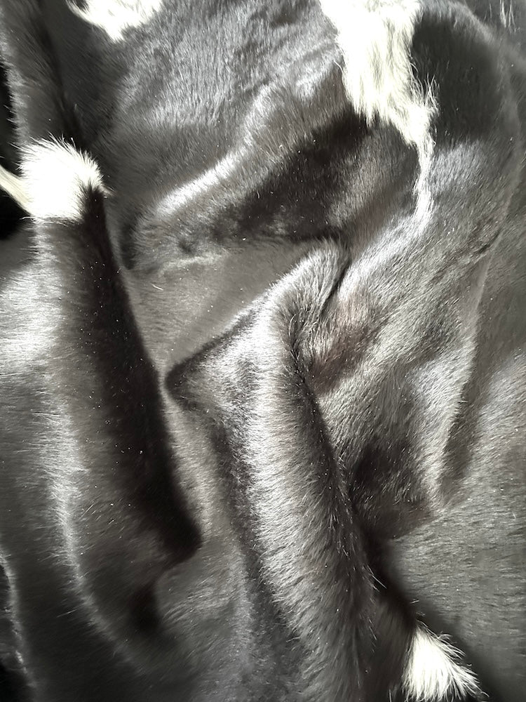 Premium cowhide rug by Cowhide Rugs London, natural patterned cowhide over 6 feet long, 192cm x 180cm, stylish and durable.