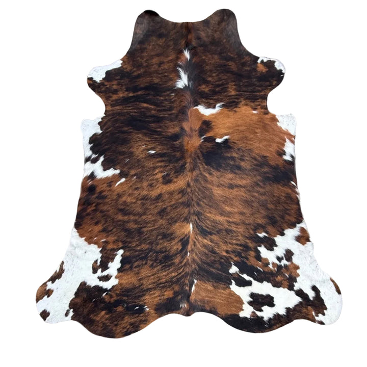 Brown and white cowhide rug 