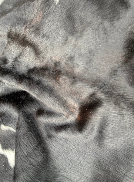 Large premium cowhide rug by Cowhide Rugs London, natural brown and white cowhide with a textured, irregular pattern, 192cm x 180cm.