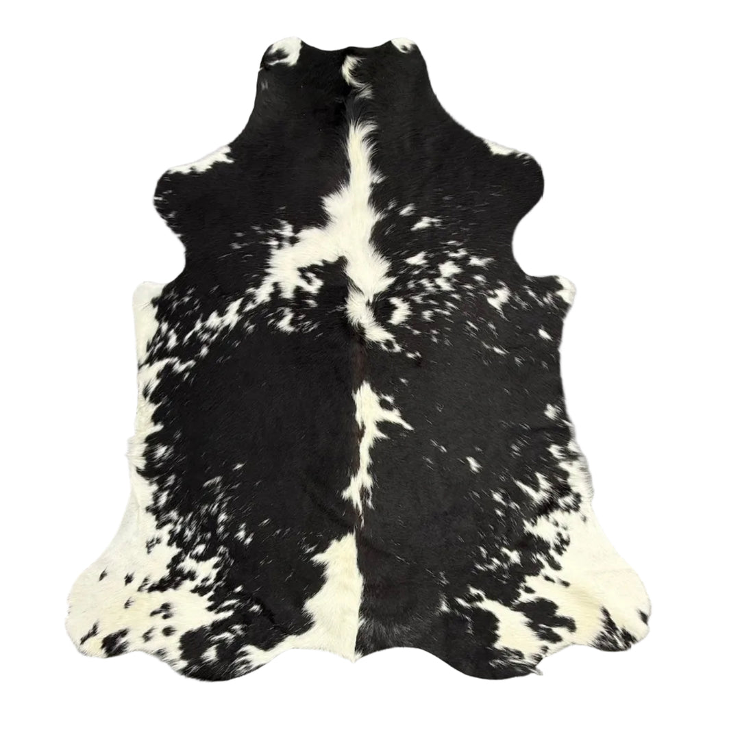 Premium cowhide rug by Cowhide Rugs London, 185cm x 154cm, featuring natural cowhide texture and distinctive pattern.