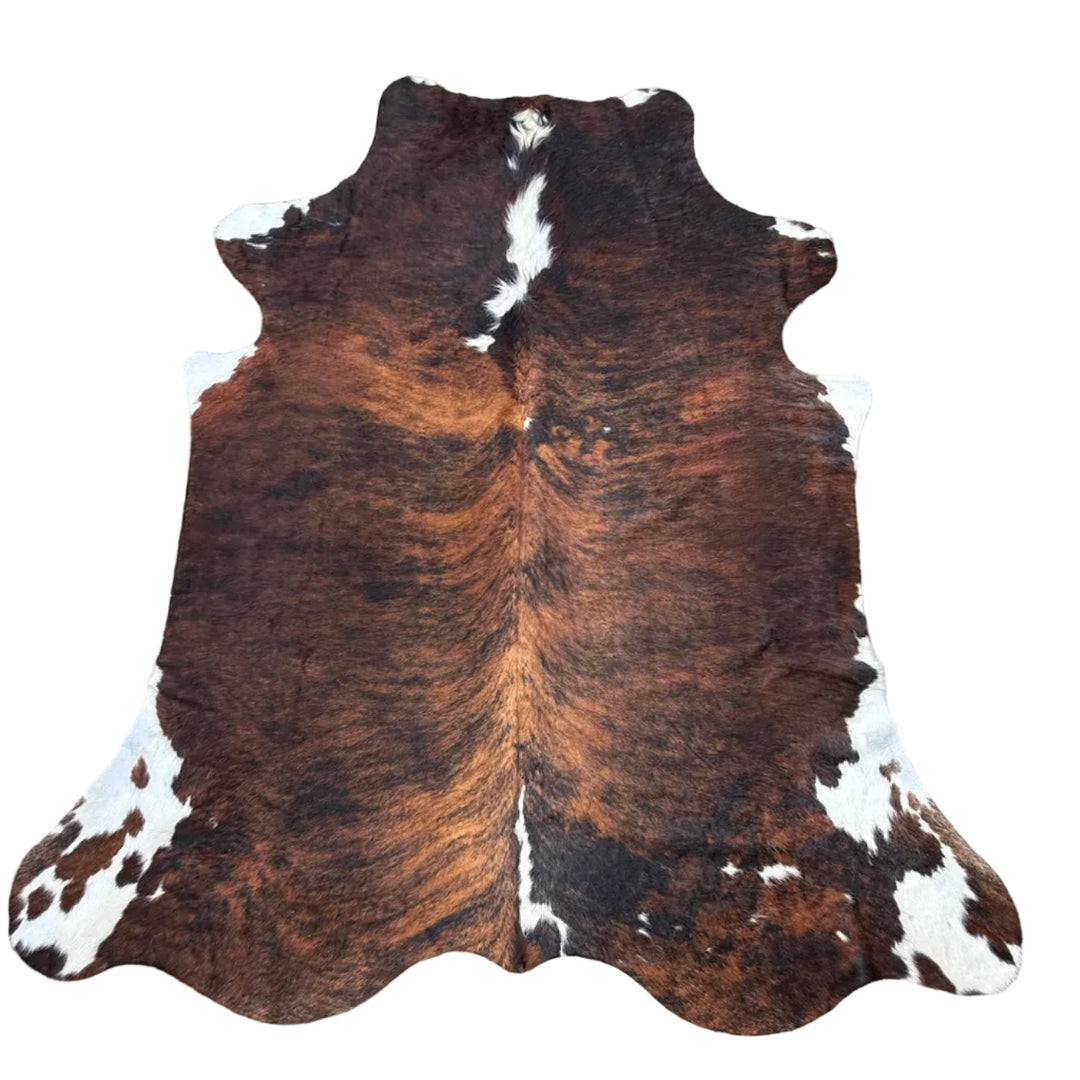 Brown and white cowhide rug 