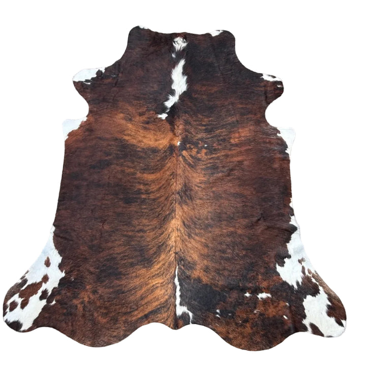 Brown and white cowhide rug 