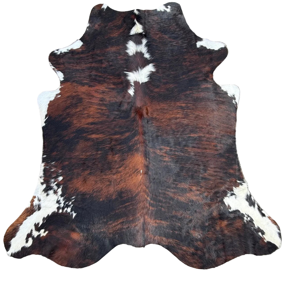 Brown and white cowhide rug 