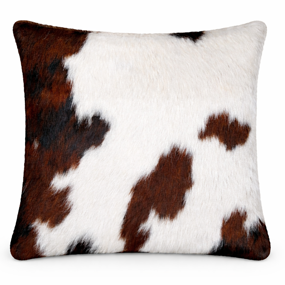 Cowhide cushion with suedette reverse, 39cm x 39cm, featuring natural cowhide pattern and soft suede backing.