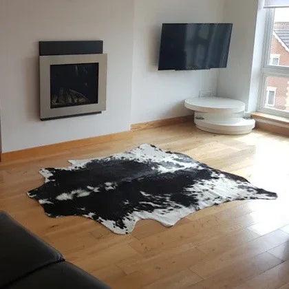 Cowhide Rugs London gift card featuring a stylish design, perfect for gifting, with a neutral color palette and elegant branding.