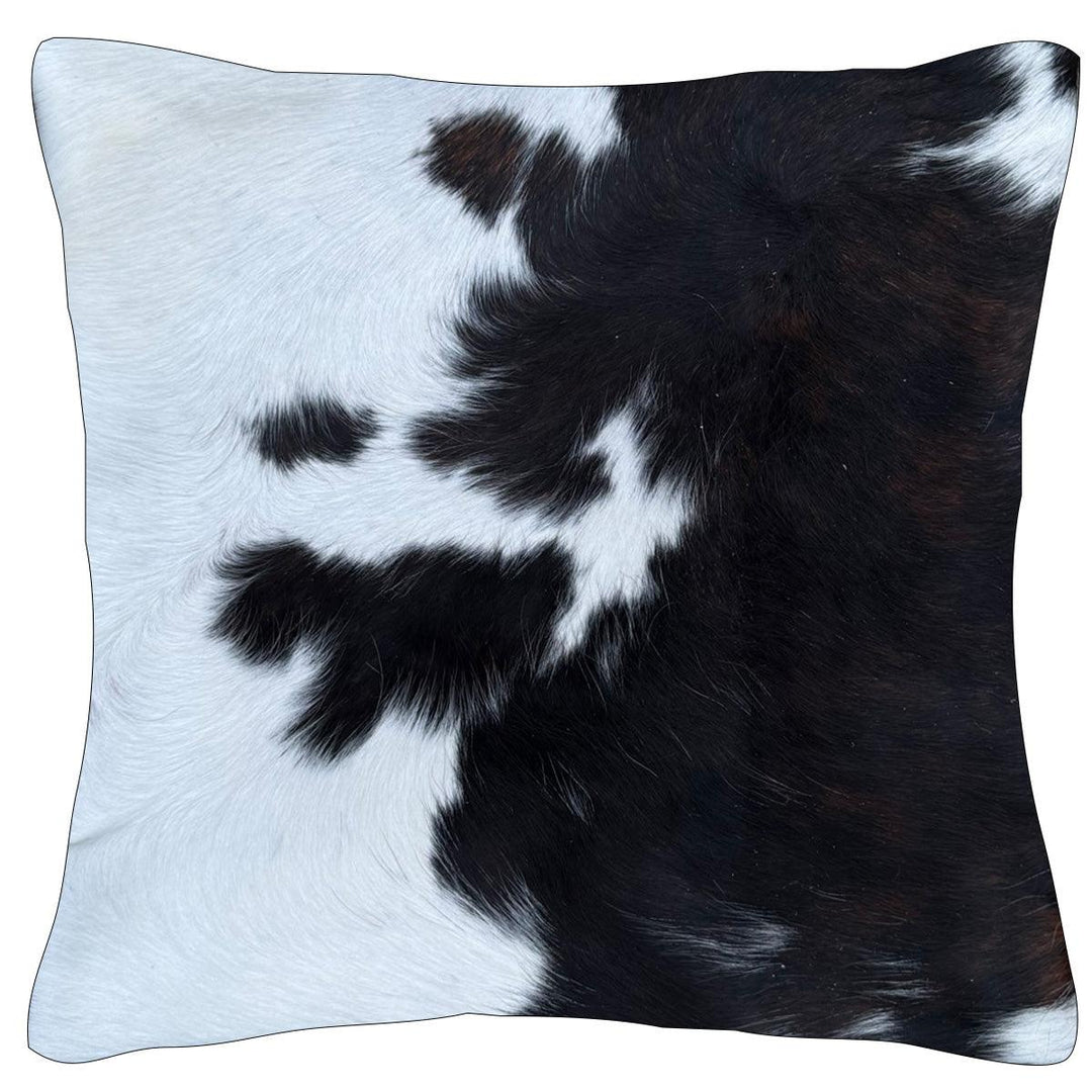 Cowhide cushion from Cowhide Rugs London with a reverse suedette finish, measuring 39cm by 39cm, featuring natural cowhide pattern.
