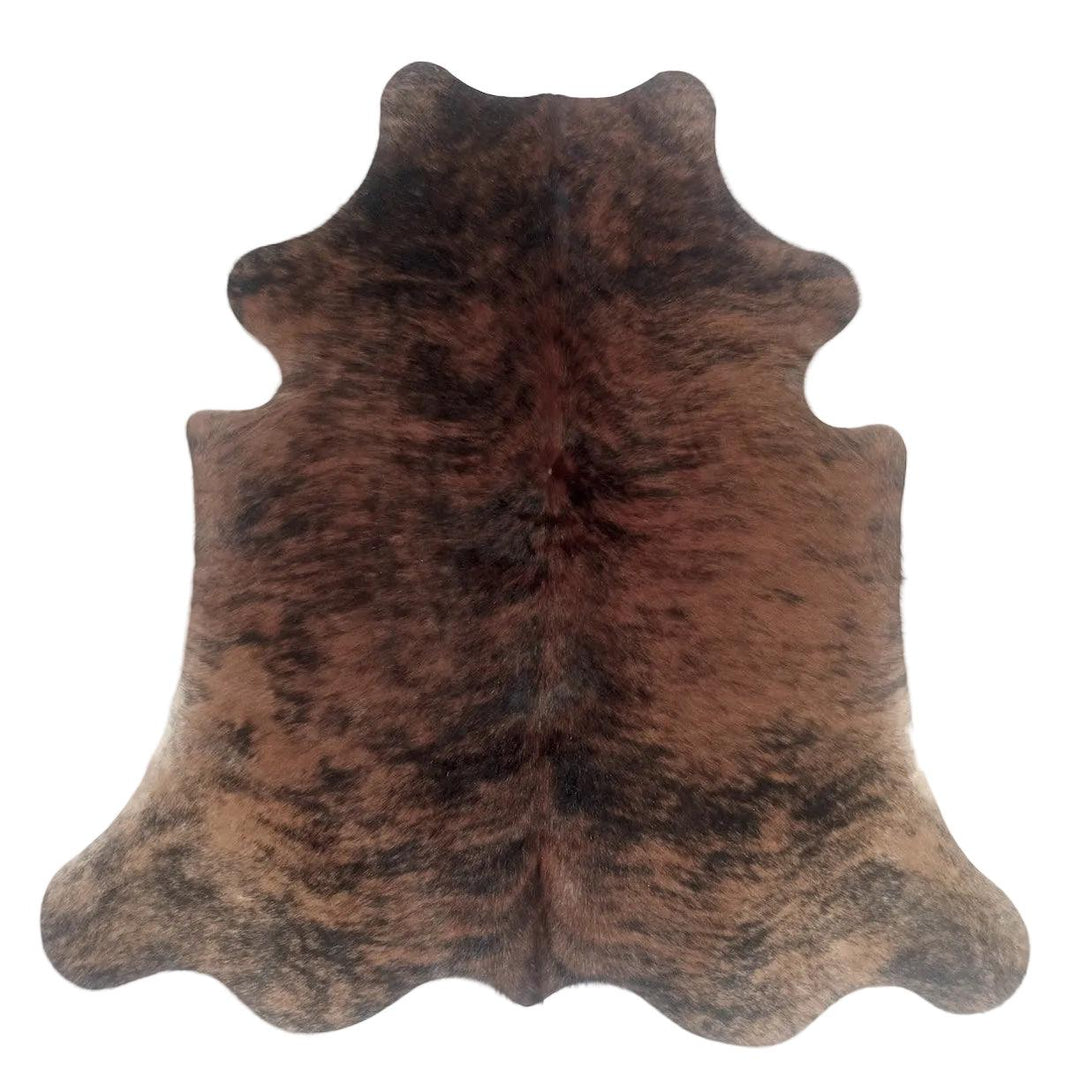 Premium cowhide rug by Cowhide Rugs London, 185cm x 160cm, featuring natural cowhide pattern and soft, textured surface.