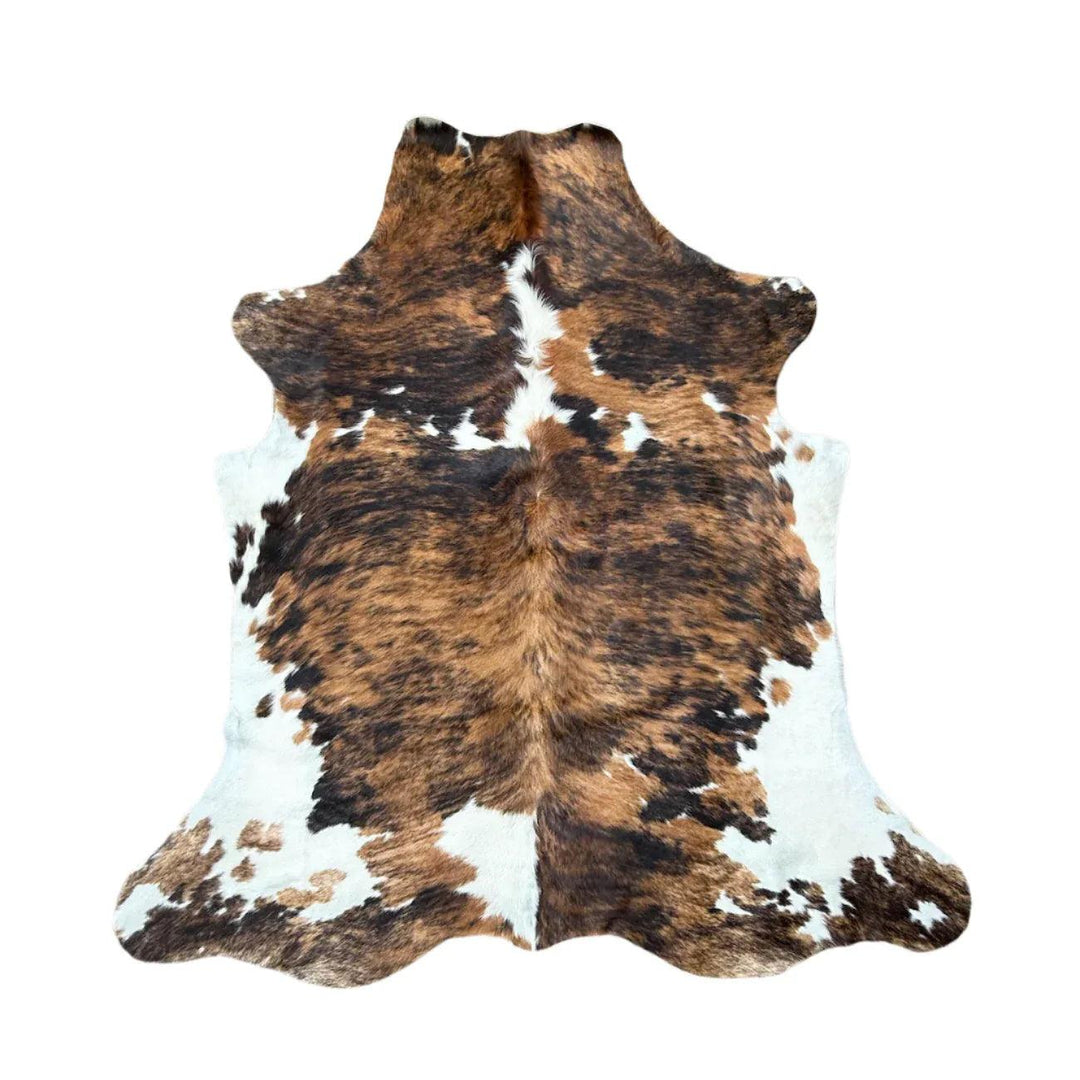 Premium cowhide rug from Cowhide Rugs London, 1.90m x 1.77m, featuring natural cowhide patterns and rich texture.