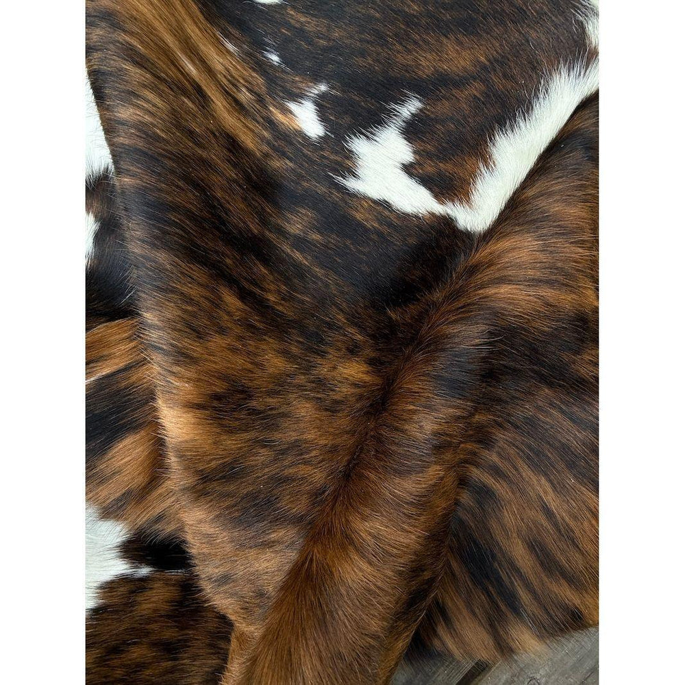 Premium cowhide rug from Cowhide Rugs London, natural cowhide with unique markings, size 1.90m x 1.77m, high-quality and durable.