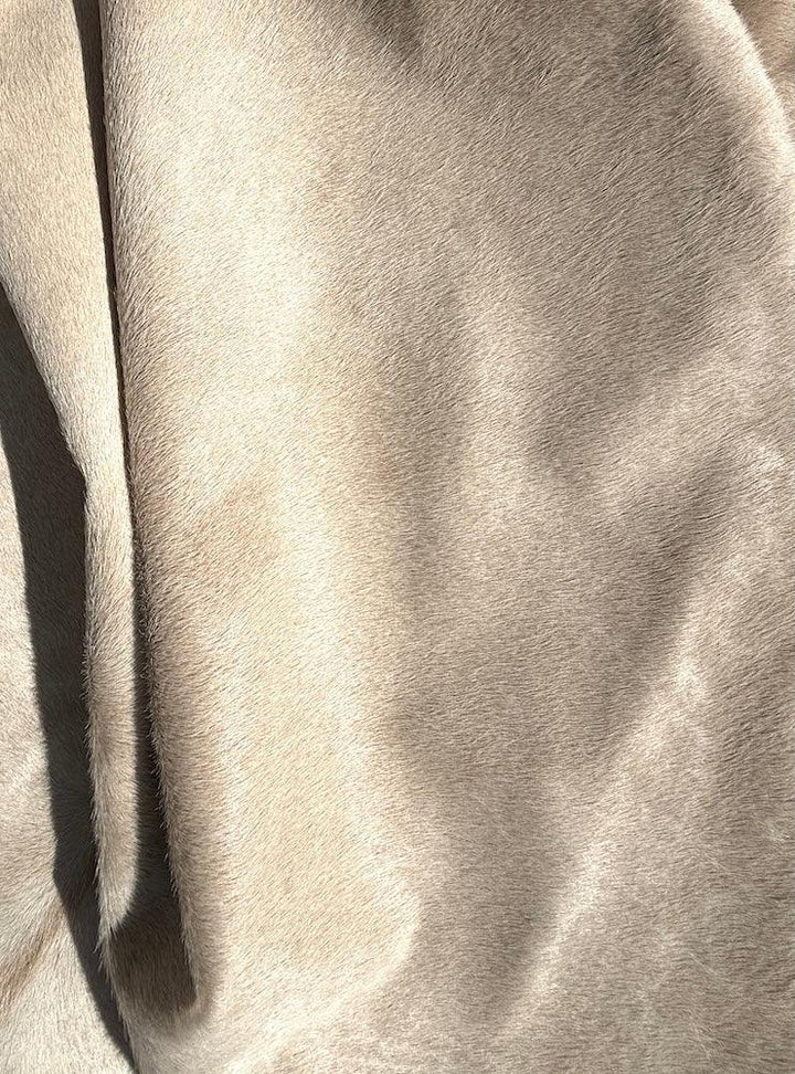 Premium cowhide rug from Cowhide Rugs London, 210cm x 180cm, featuring natural cowhide with unique patterns and textures.