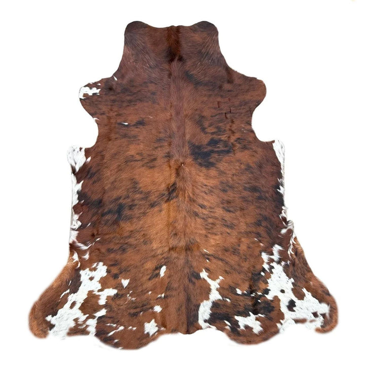 Premium cowhide rug by Cowhide Rugs London, 205cm x 170cm, natural cowhide with distinctive pattern and soft texture.
