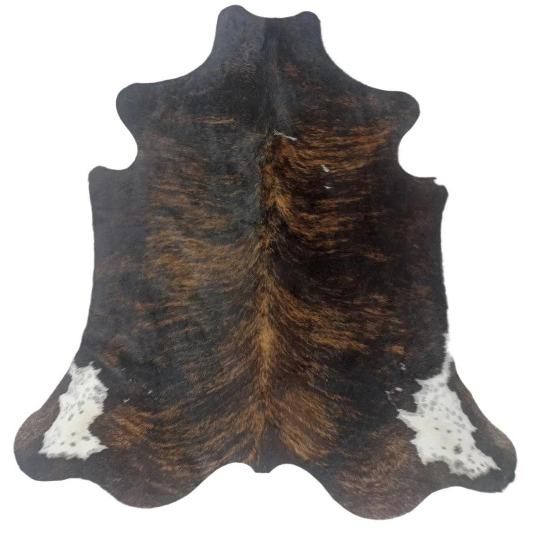 Premium cowhide rug from Cowhide Rugs London, natural leather with a 180cm by 169cm size, showcasing a unique pattern and texture.