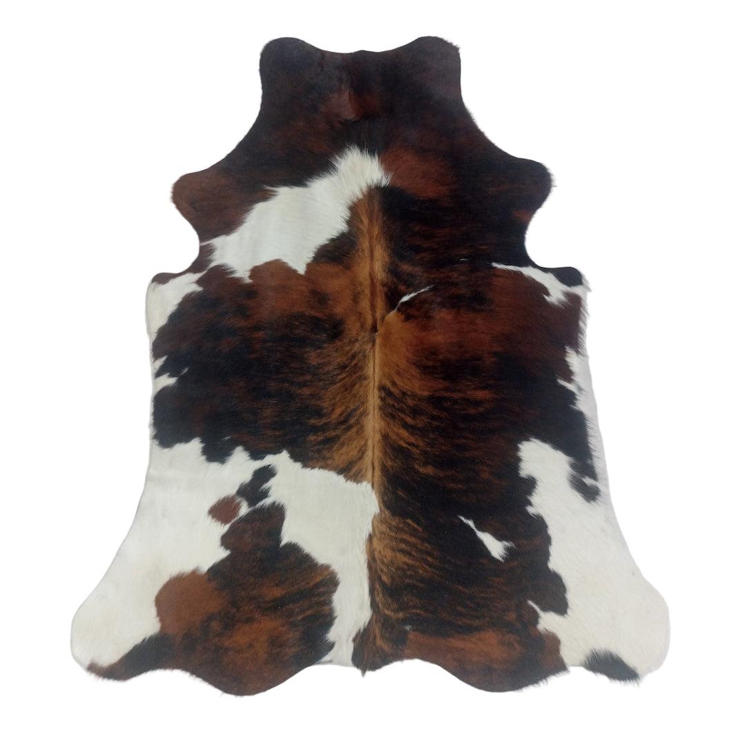 Premium cowhide rug from Cowhide Rugs London, 181cm x 152cm, natural cowhide with a distinctive pattern, small size.