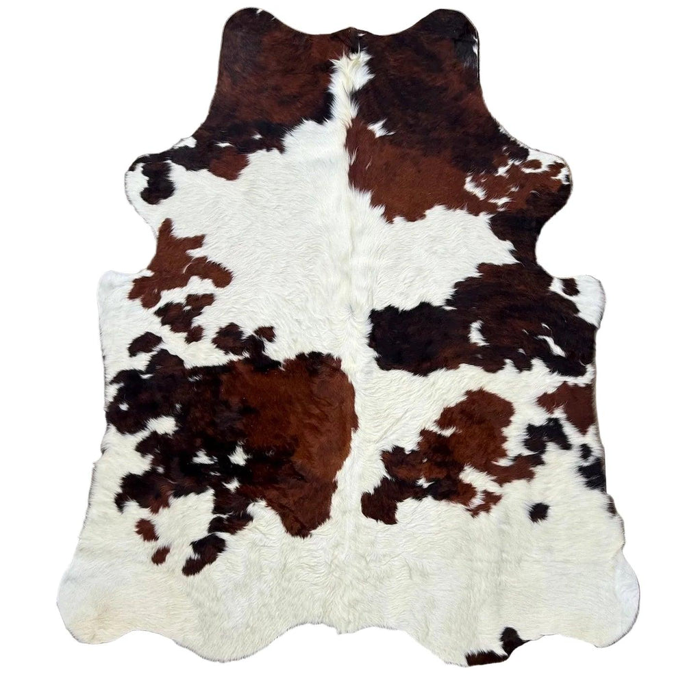 Premium cowhide rug from Cowhide Rugs London, 160cm x 145cm, natural cowhide with distinctive patterns and soft texture.