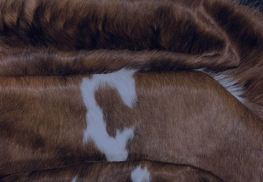Premium Cowhide Rug AM285 from Cowhide Rugs London, natural 201cm x 193cm cowhide rug with a smooth, patterned leather surface.