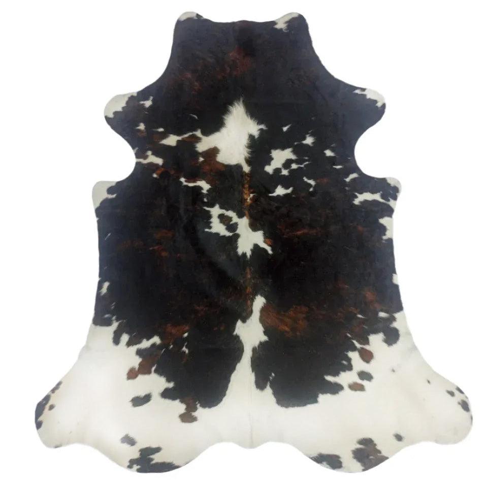 Large premium cowhide rug from Cowhide Rugs London, natural cowhide with distinctive markings, measuring 235cm by 202cm.