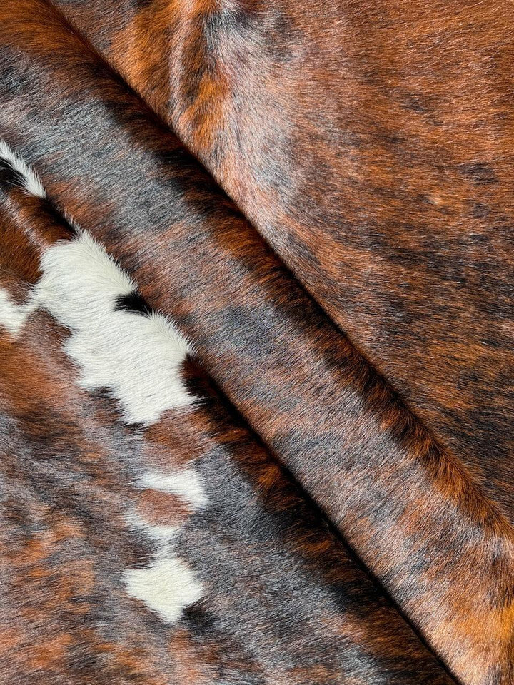 Premium Cowhide Rug from Cowhide Rugs London, natural cowhide with distinctive markings, measuring 234cm by 198cm.