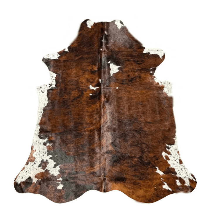 Premium Cowhide Rug by Cowhide Rugs London showing a large, natural cowhide with a mix of brown and white patches.