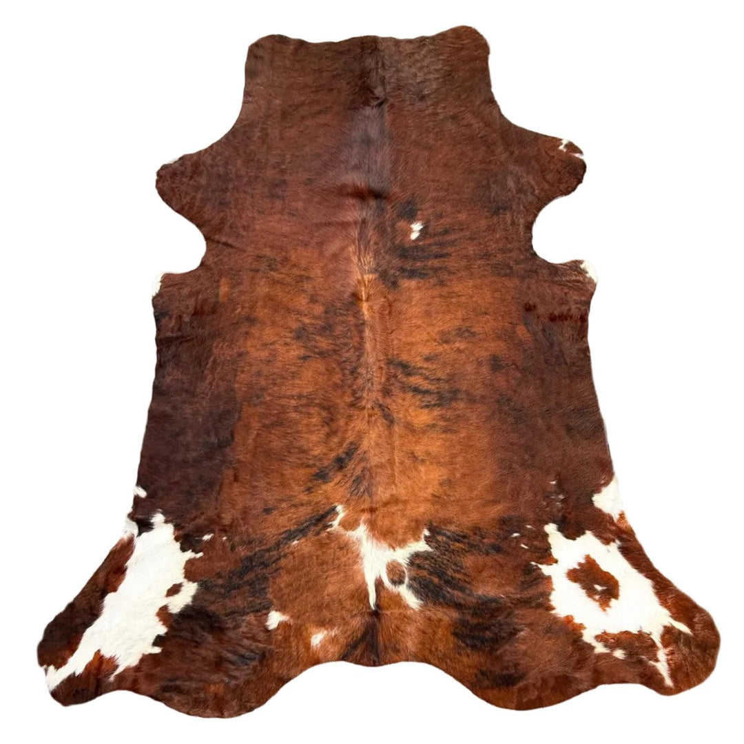 Premium cowhide rug by Cowhide Rugs London, XXL size 240cm x 200cm, natural cowhide with distinctive markings.