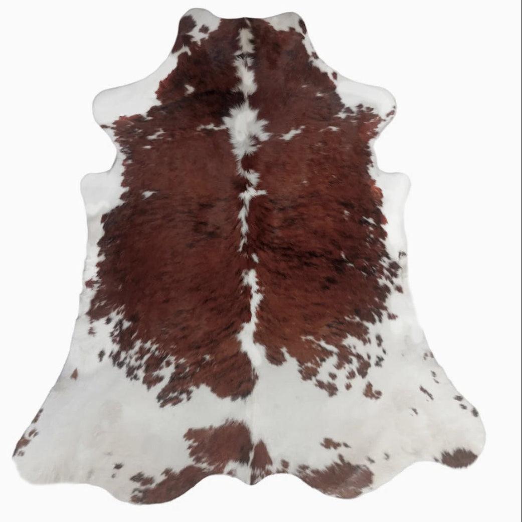 Premium cowhide rug from Cowhide Rugs London, XL size 237cm x 200cm, with natural cowhide pattern and soft texture.