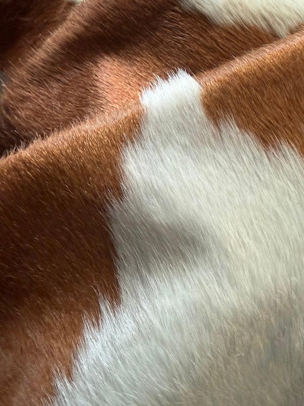 Premium cowhide rug from Cowhide Rugs London, XL size 210cm x 200cm, natural cowhide texture and pattern.