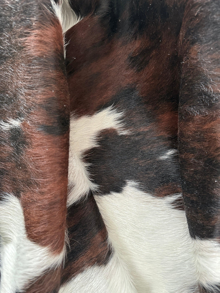 Premium Cowhide Rug from Cowhide Rugs London, 210cm x 180cm, natural cowhide with unique pattern and soft texture.