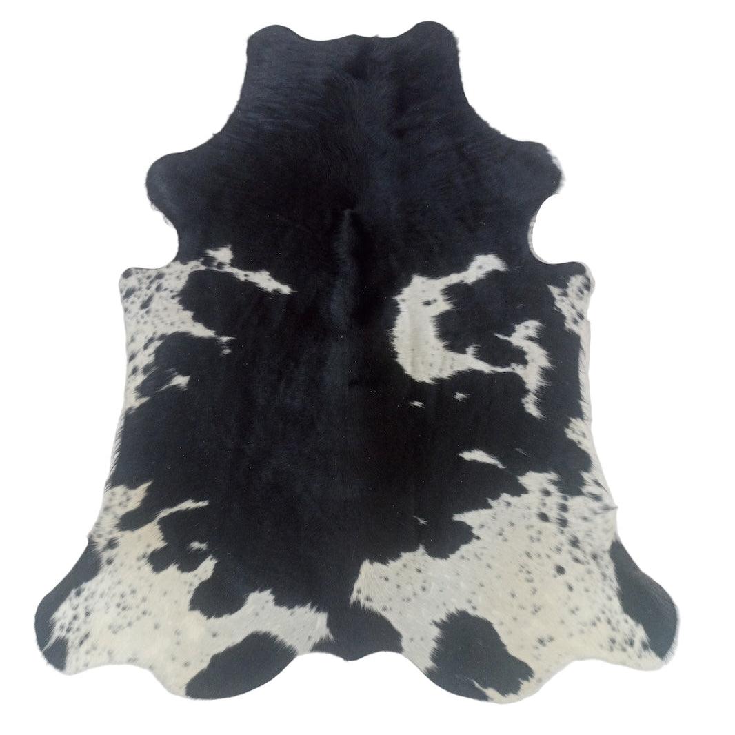 Premium medium cowhide rug by Cowhide Rugs London, showcasing natural cowhide with a mix of brown and white patches.