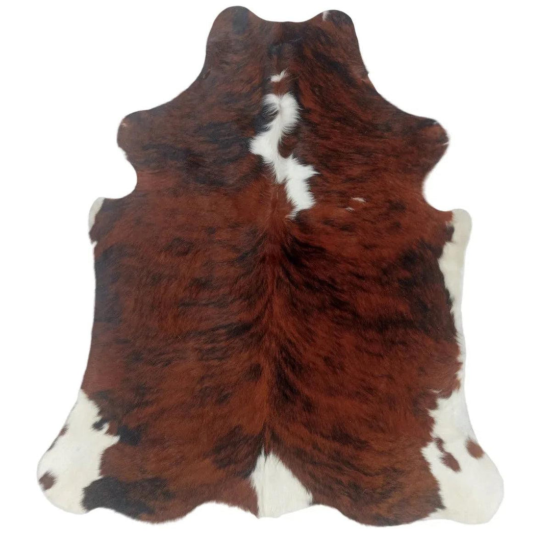 Cowhide Rug MY1312 from Cowhide Rugs London, small 1.70m x 1.40m, natural cowhide with distinctive pattern and texture.
