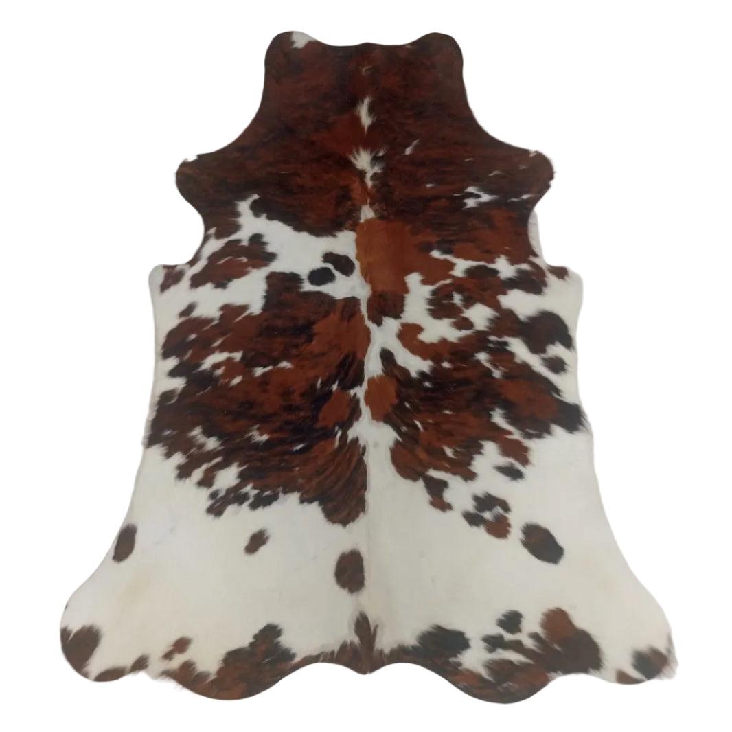 Cowhide Rug N45732 from Cowhide Rugs London, 1.85m x 1.47m, featuring natural cowhide with a mix of white and brown patches.