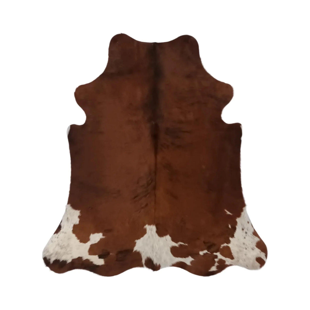 Small Cowhide Rug from Cowhide Rugs London, natural cowhide with black and white patches, measuring 70 x 66 inches.