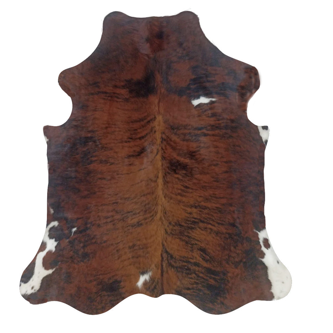 Brown and black cowhide rug with white spots