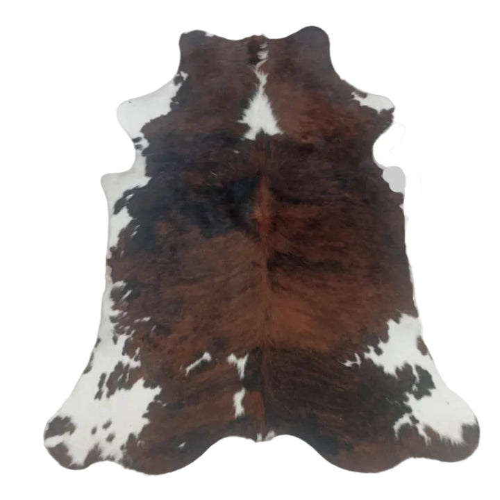 Brown and white cowhide rug 