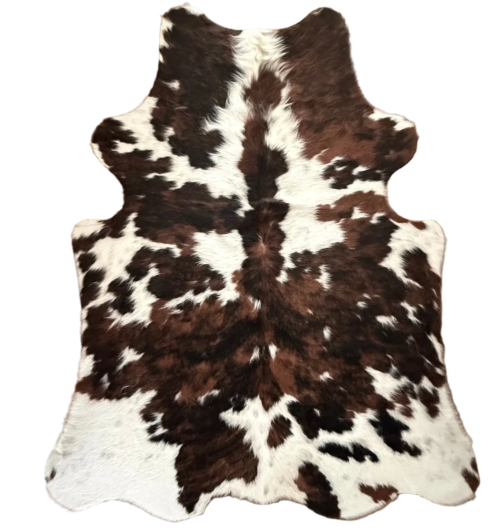 Brown and white cowhide rug 