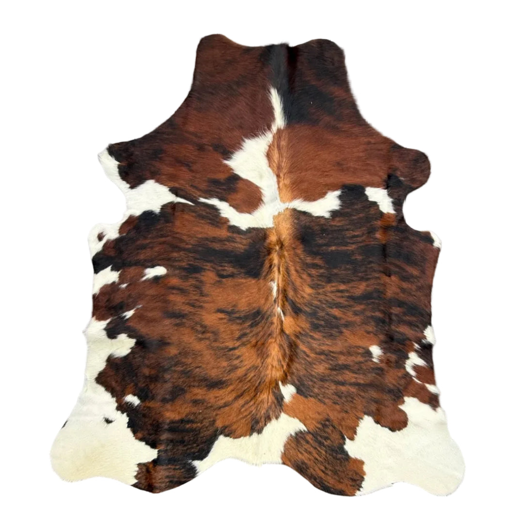 Brown and white cowhide rug 