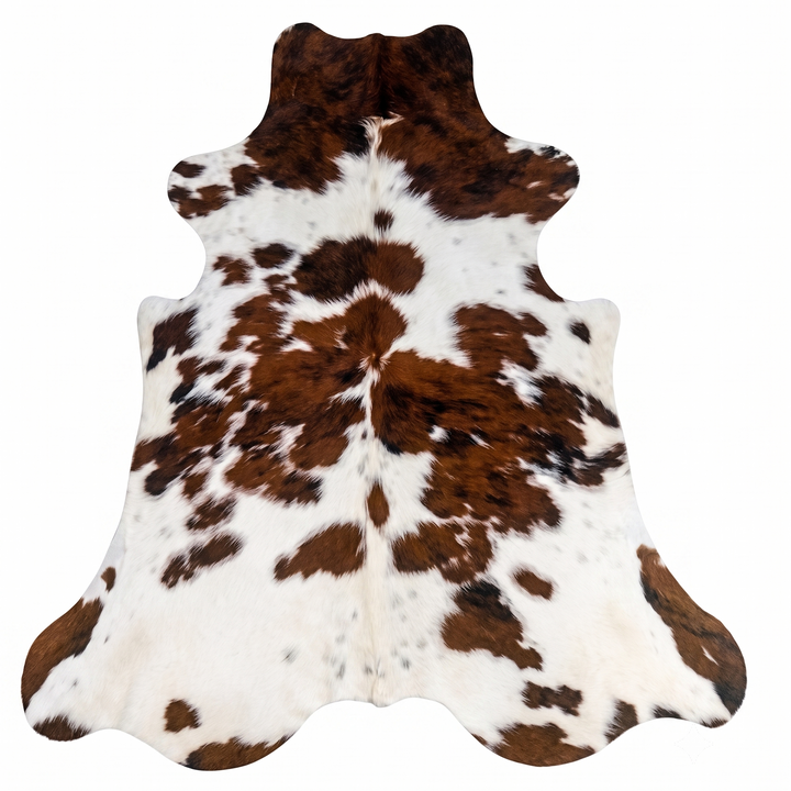 Brown and white cowhide rug with natural spotted pattern, shown flat against a white background.