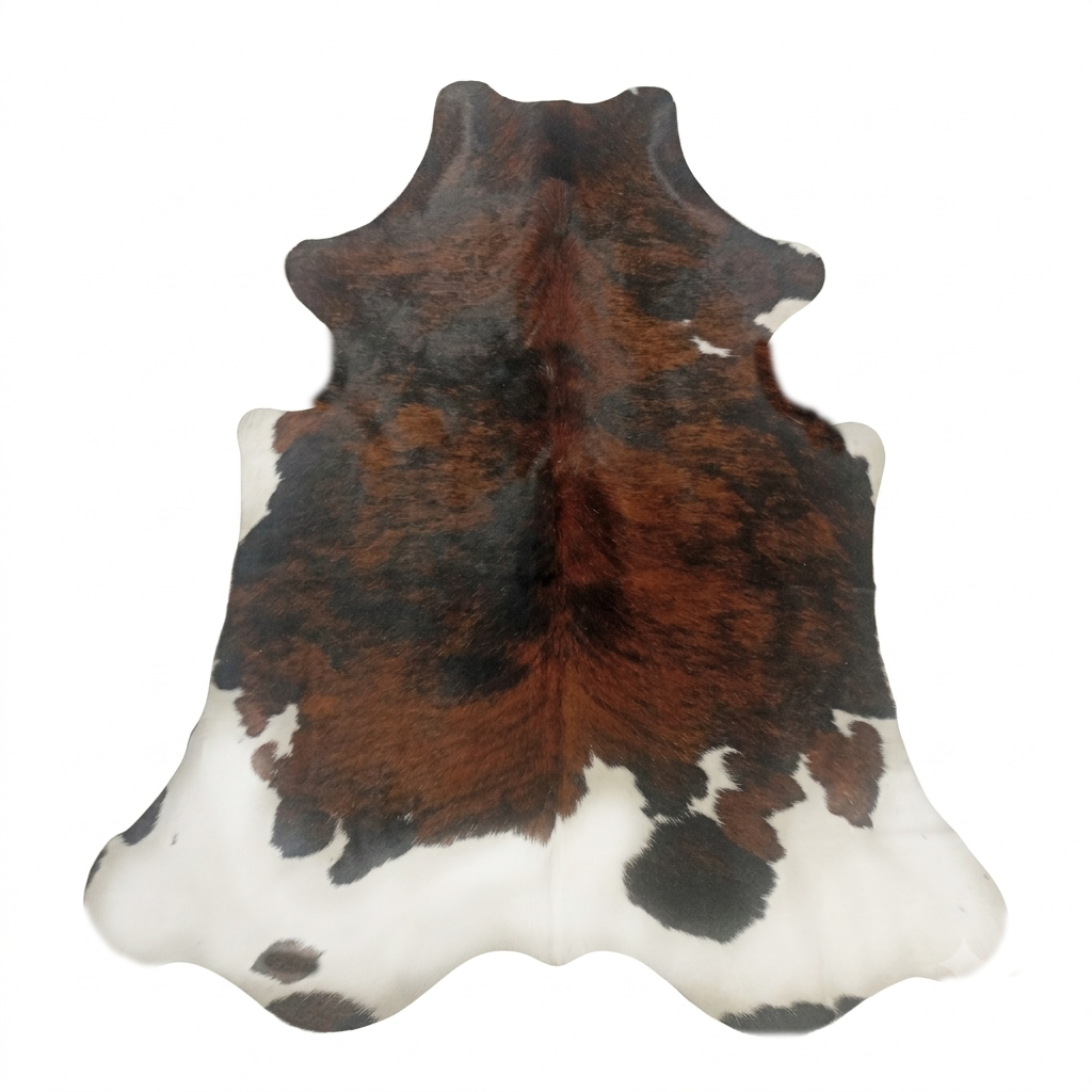 Cowhide rug with brown, black, and white pattern on a white background