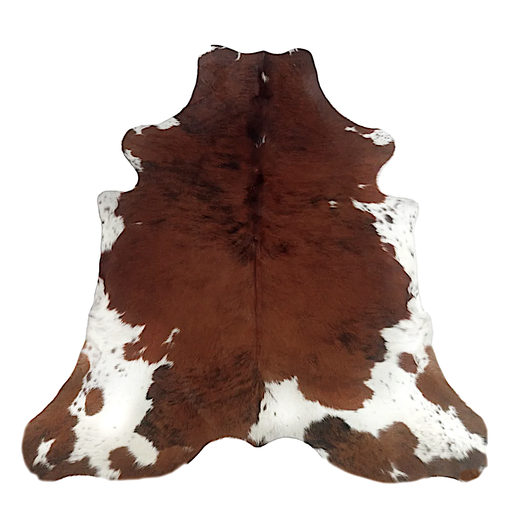 Brown and white cowhide rug on a white background