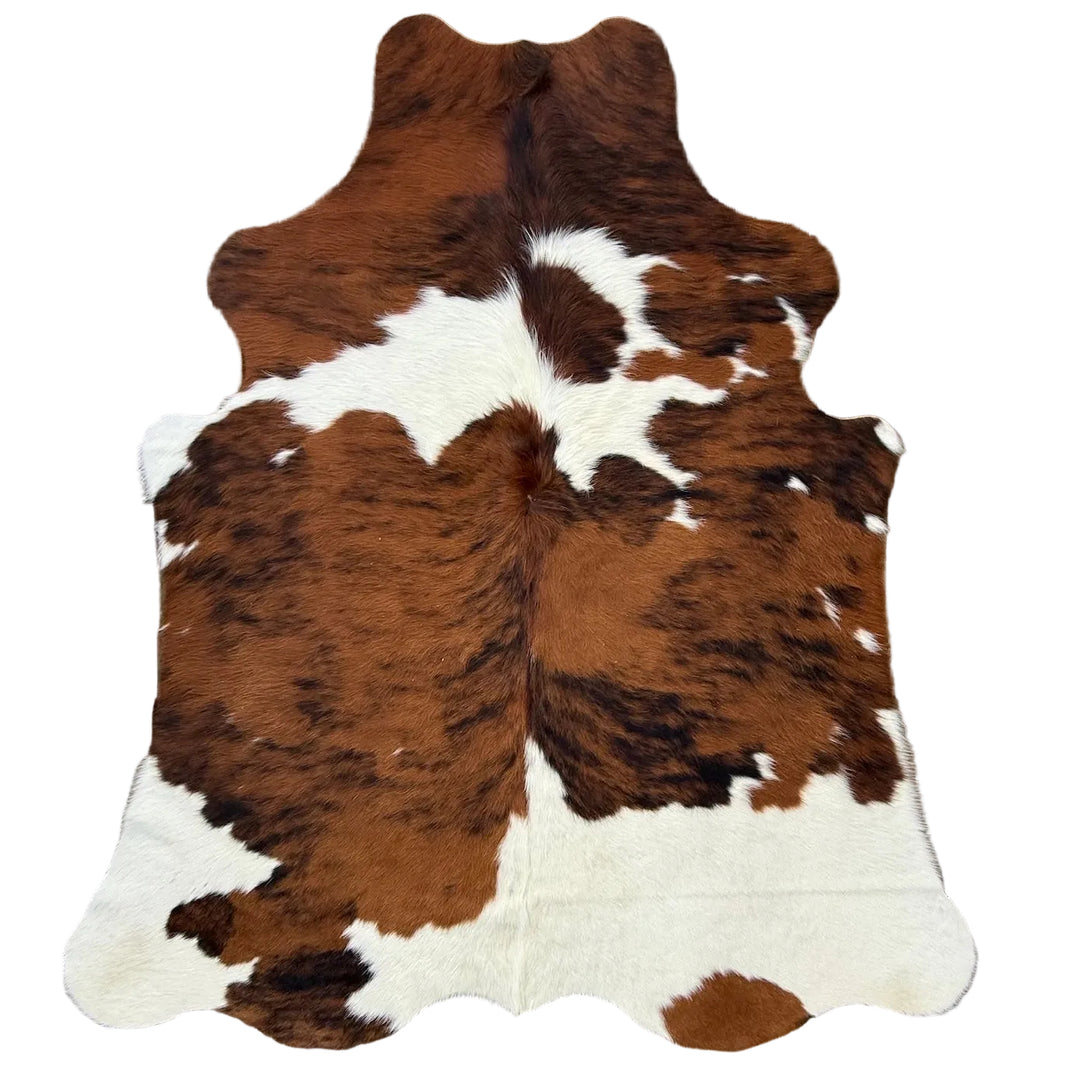 Brown and white cowhide rug 