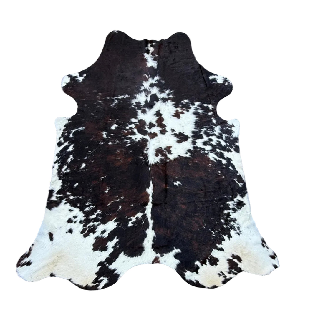 A natural black and white cowhide rug 