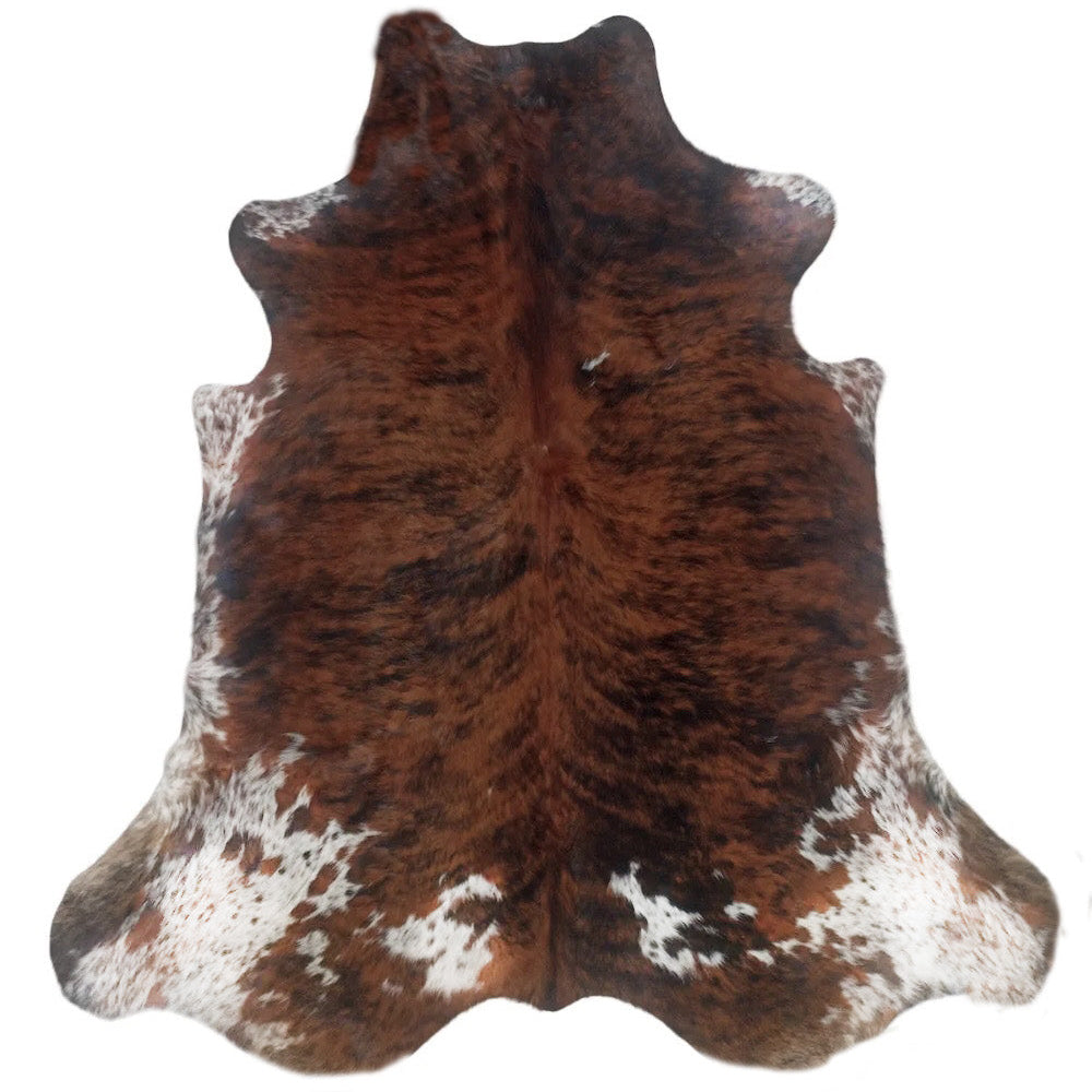 Large premium cowhide rug from Cowhide Rugs London, 235cm x 215cm, natural cowhide with distinctive color patterns and soft texture.