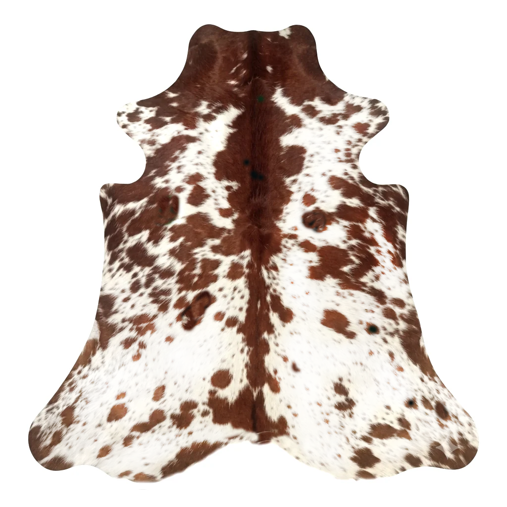 Brown and white cowhide rug on a white background